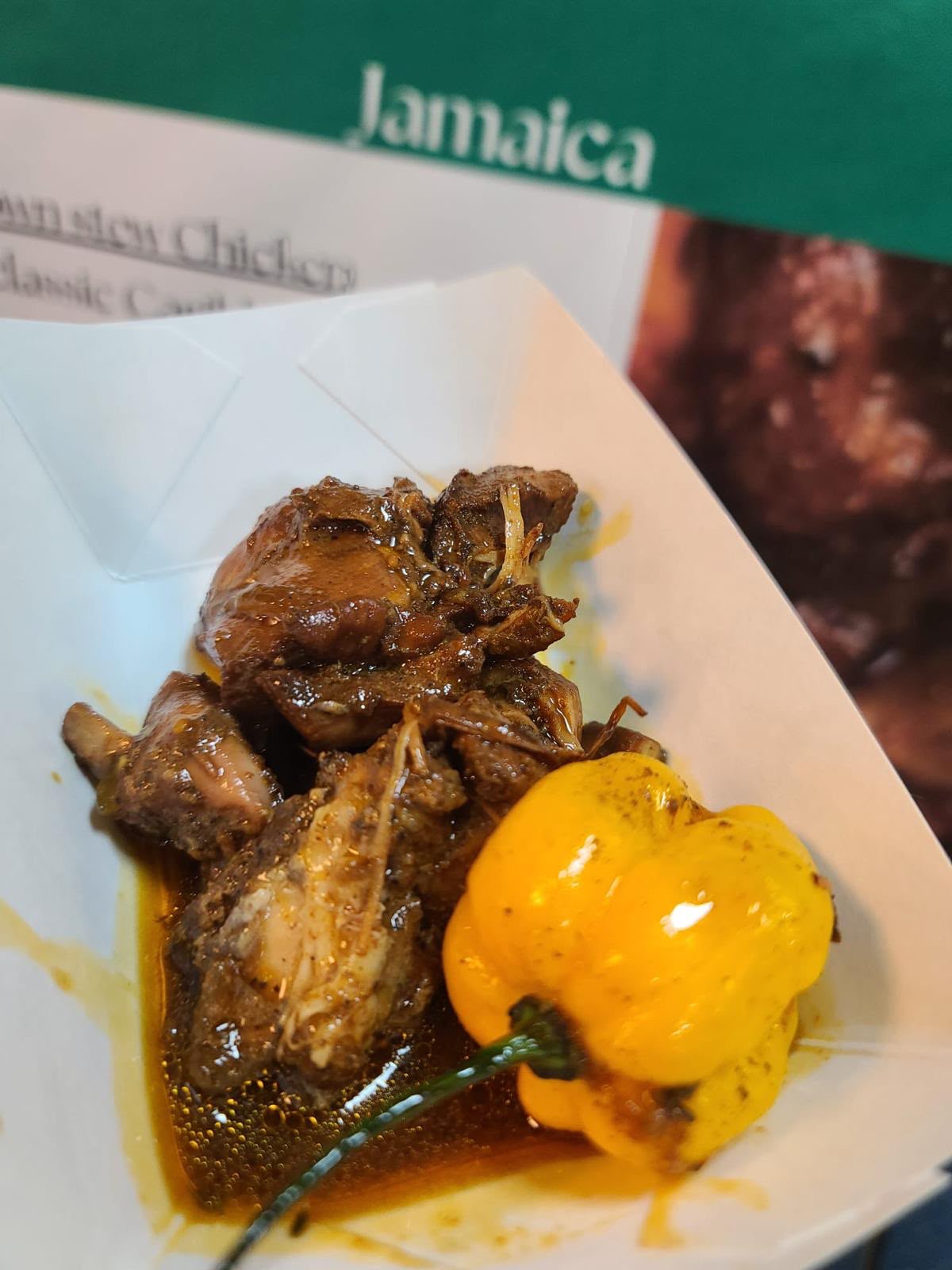 Jamaican stewed chicken featured during a Caribbean food experience